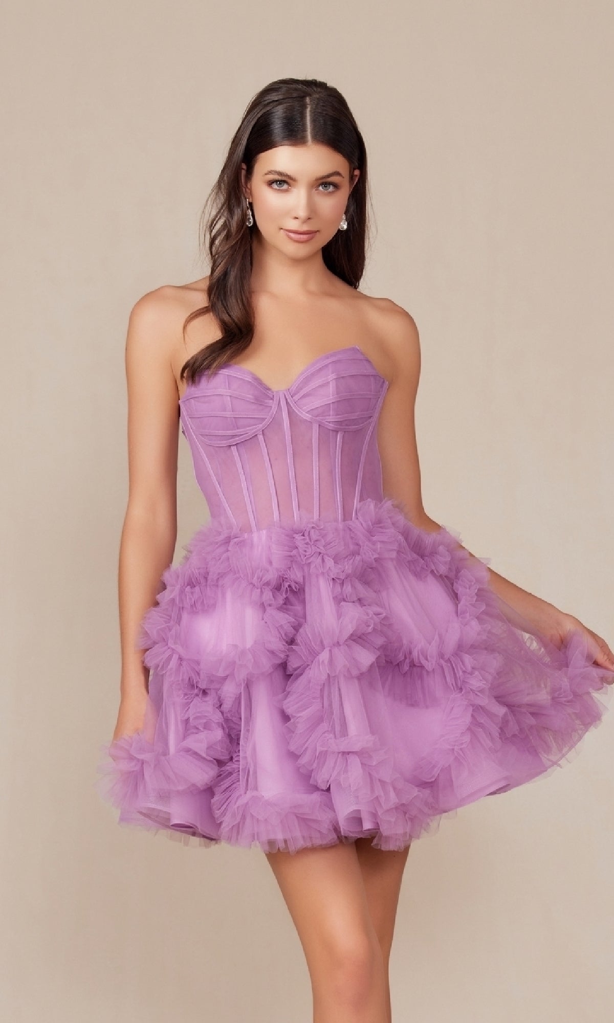 A woman poses against a beige background in the Short Strapless Ruffled Homecoming Dress Y859, featuring lilac tulle, a structured bodice, and a ruffled mini skirt.